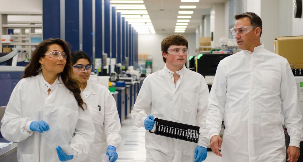 Hologic lab employees walking in a lab